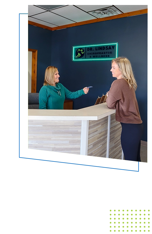 Chiropractic Basehor KS Kim Lindsay And Leslie Lindsay Performing Patient Check In